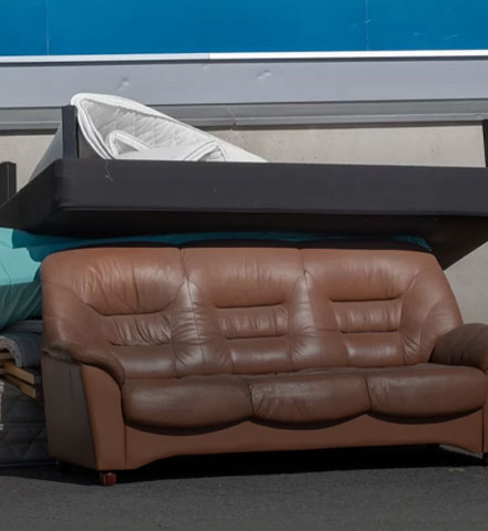 A couch and mattress loaded for haul-away at a furniture removal job in Portland Maine